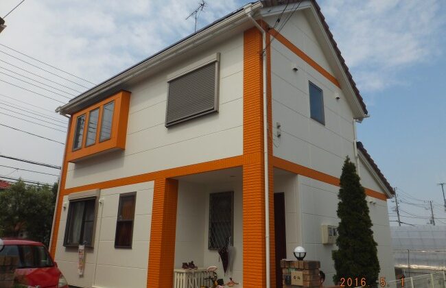 オレンジと白の外壁塗装・ベランダ防水工事を高耐久施工|船橋市